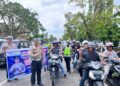 Kasat Lantas AKP Fajri Sentosa Bersama Polwan Bagikan Helm Operasi Keselamatan LK 2024