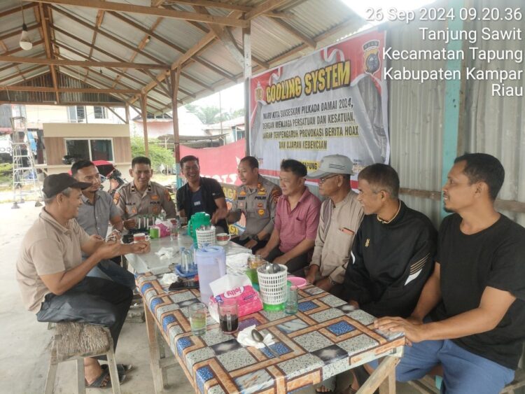 Upaya Menciptakan Pilkada Damai 2024″ Waka Polsek Tapung Sasar Warga Tanjung Sawit Jaga Persatuan dan Kesatuan